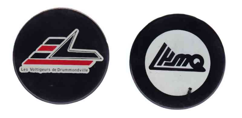 1985-93 QMJHL IN GLAS CO DRUMMUNDVILL VOLTIGEURS GAME PUCK photo 1985-93 QMJHL IN GLAS CO DRUMMUNDVILL VOLTIGEURS GAME PUCK photo
