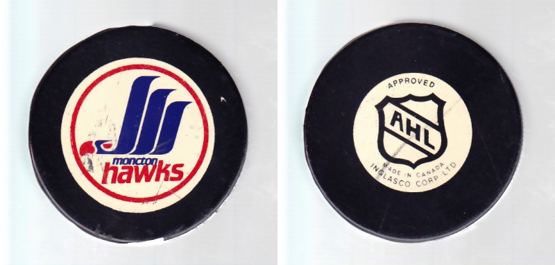 1986-93 AHL IN GLAS CO MONCTON HAWKS GAME PUCK photo 1986-93 AHL IN GLAS CO MONCTON HAWKS GAME PUCK photo