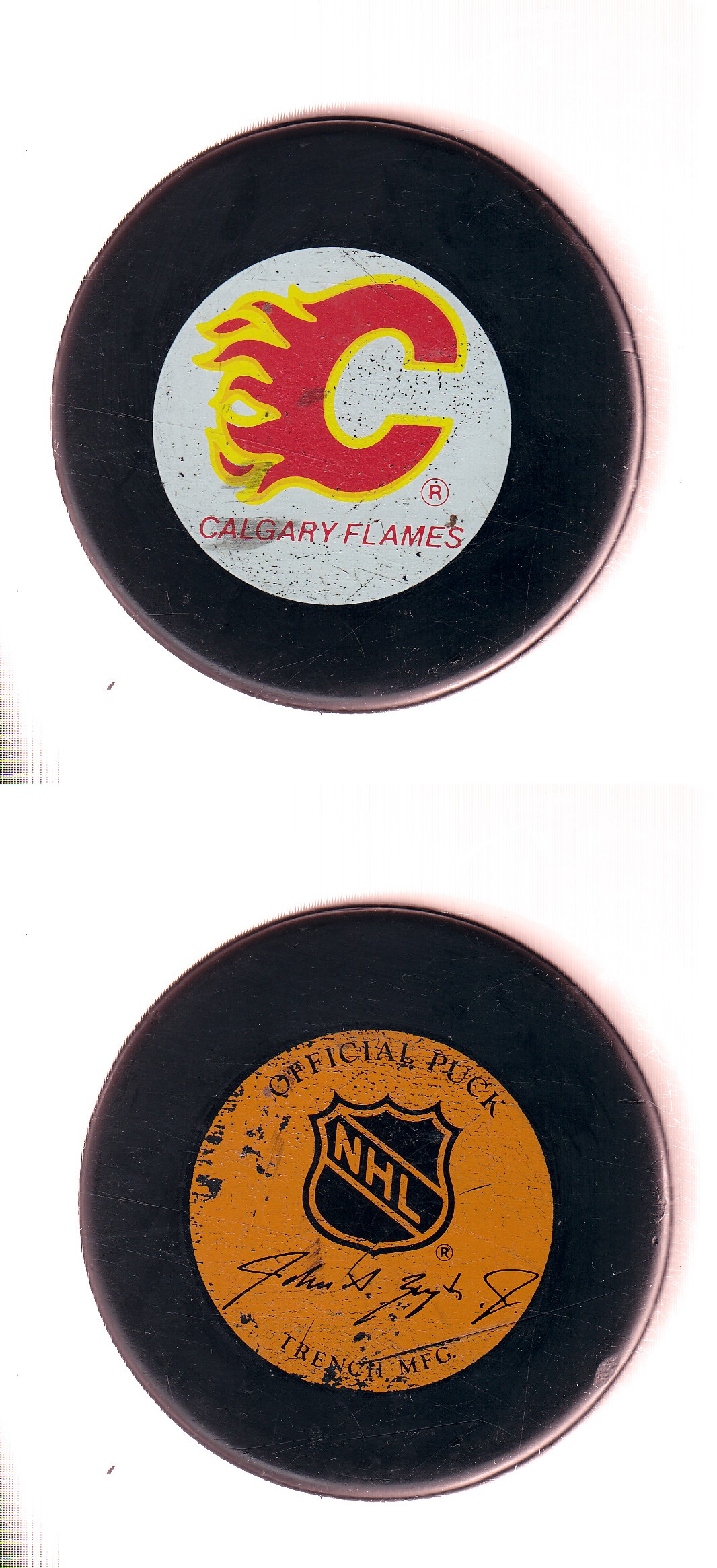 1982-92 GT1 (WITH OFFICIAL) CALGARY FLAMES GAME PUCK photo 1982-92 GT1 (WITH OFFICIAL) CALGARY FLAMES GAME PUCK photo